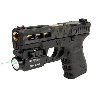 Zaffiri Precision branded OLIGHT Baldr S mounted on custom pistol upper for Glock compatibility, displaying green laser targeting and IPX4 water-resistant build in action – standalone $129.75 or free in limited July tactical accessories deal.