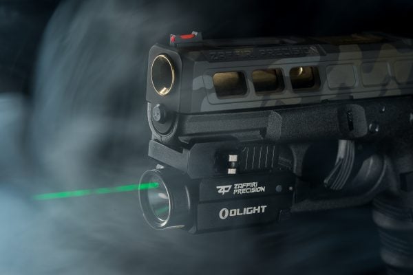Side view of Zaffiri Precision IBS complete upper on Glock, featuring the OLIGHT Baldr S compact WML with green laser sight and bright LED beam, highlighting superior custom slide machining and $129.75 value free promotion ending July 31.